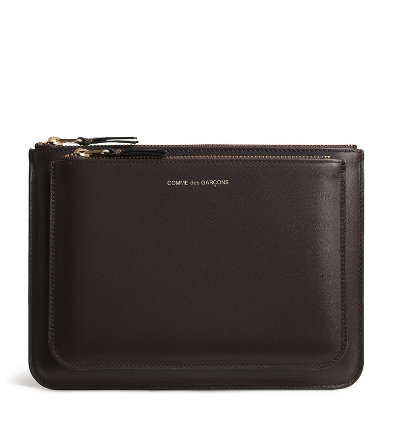 Comme Des Garçons large leather exterior pocket wallet, imported from the UK