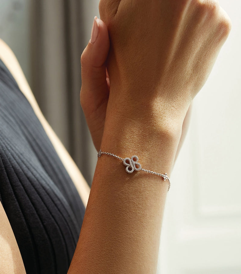 Boodles white gold diamond charm bracelet, imported from the UK