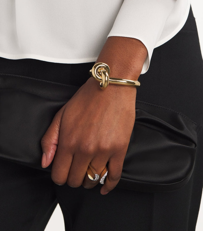 Engelbert yellow gold knot bangle with circular detailing - British product