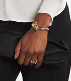 Engelbert yellow gold knot bangle with circular detailing - British product