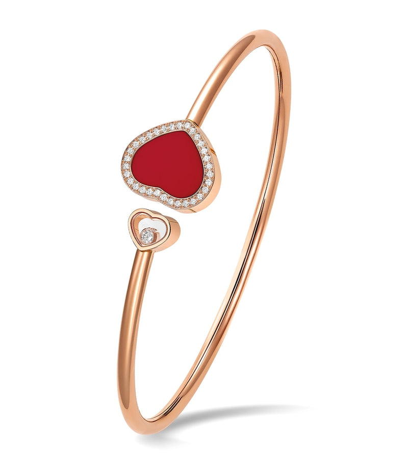 Chopard Happy Hearts rose gold bangle with moving diamond and red stone (British brand)