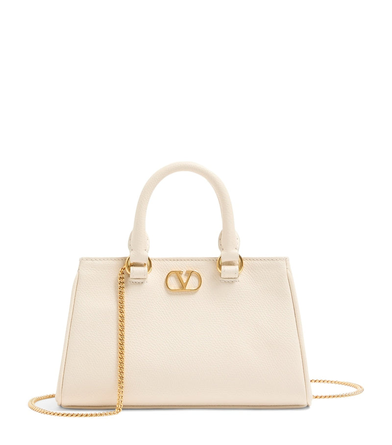 Valentino Garavani VLogo Mini top-handle bag in grained leather (British brand)
