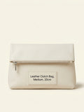 Pre-loved Balenciaga orange leather Motocross envelope clutch bag (British brand)