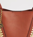 Chloé small raffia-effect leather Spin tote bag (British brand)