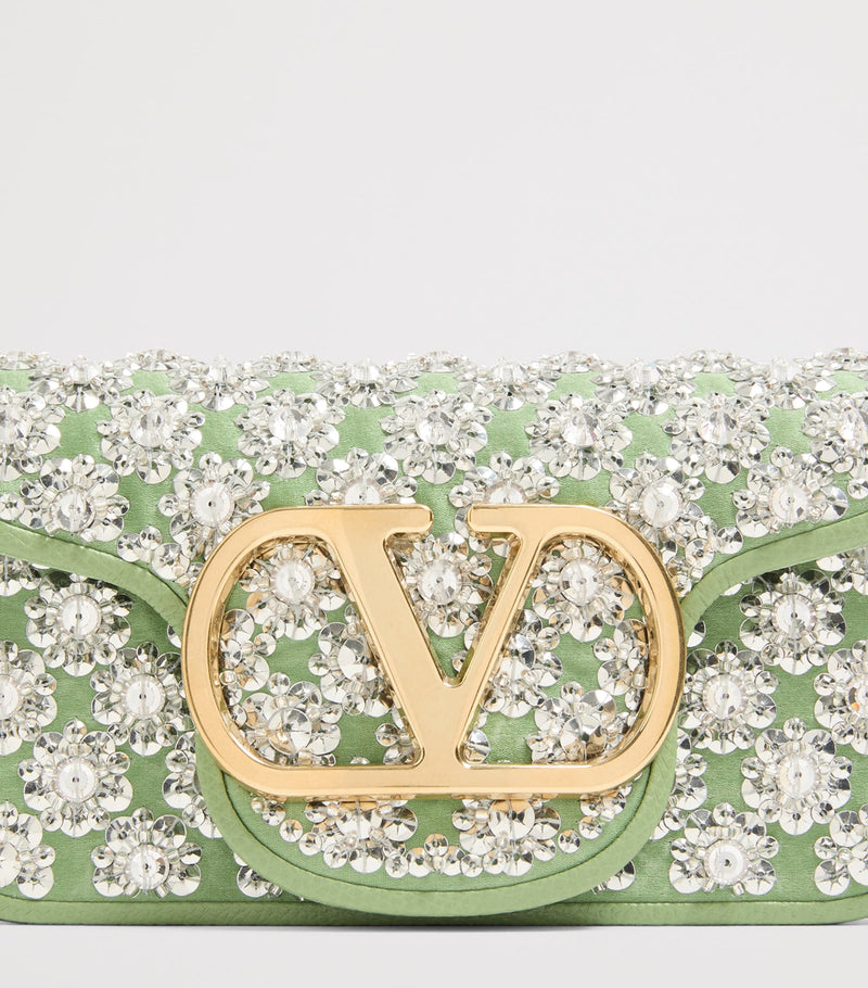 Valentino Garavani small Locò embellished shoulder bag, imported from the UK