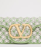 Valentino Garavani small Locò embellished shoulder bag, imported from the UK