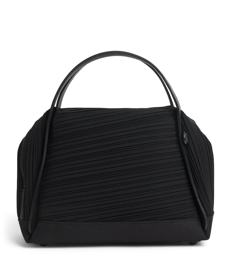 Pleats Please Issey Miyake bias pleats top-handle bag, imported from the UK