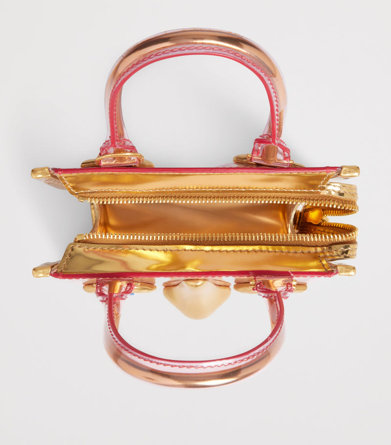 Schiaparelli mini vinyl Face top-handle bag - British product