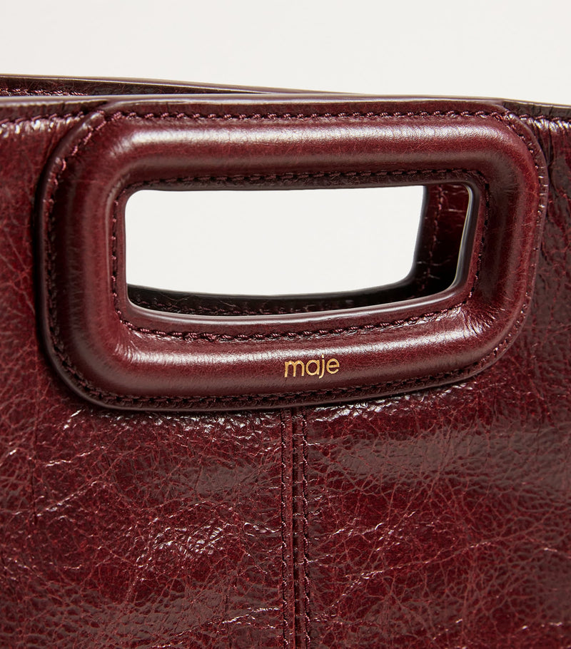 Maje cracked leather fringed M handbag (British brand)