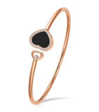 Chopard rose gold bangle with moving diamond and onyx, imported from the UK