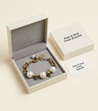 Alexander McQueen faux pearl and skull bracelet (British brand)