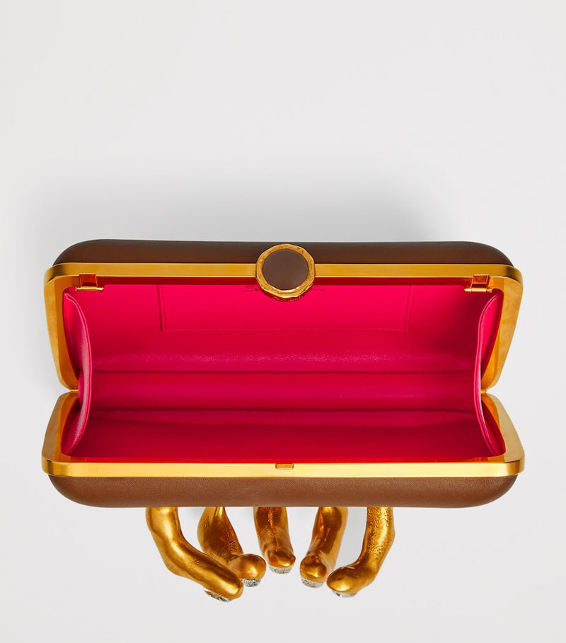 Schiaparelli Hand In Hand clutch bag with rhinestone fingernails, imported from the UK