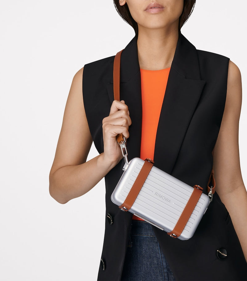 RIMOWA aluminium cross-body bag with leather strap (British brand)