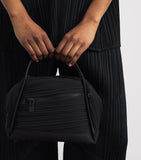 Pleats Please Issey Miyake bias pleats top-handle bag, imported from the UK