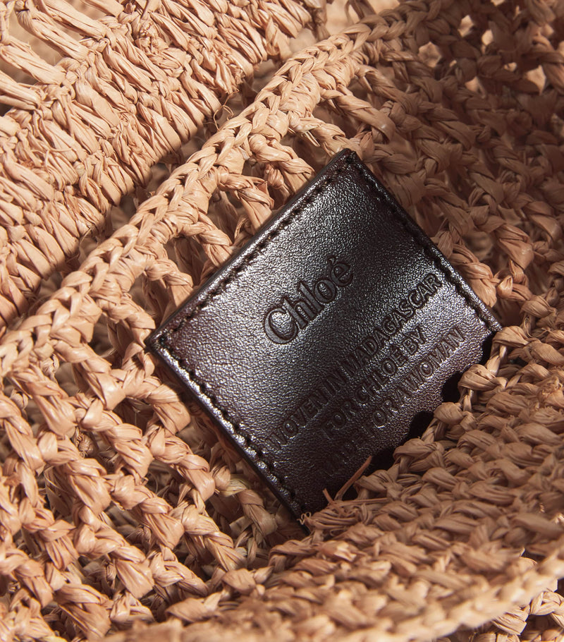 Chloé handwoven banana tote bag with gold charm, imported from the UK