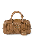 Miu Miu Arcadie matelassé leather top-handle bag, imported from the UK