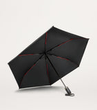 Tumi medium umbrella with red accents and reflective trim (British brand)