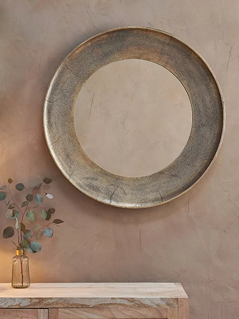 nkuku Yakira round wall mirror antique brass, UK version