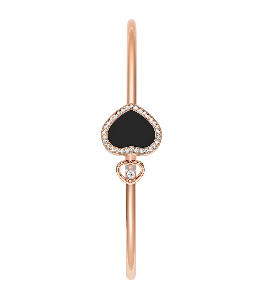 Chopard rose gold bangle with moving diamond and onyx, imported from the UK