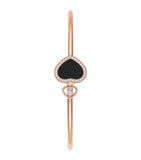 Chopard rose gold bangle with moving diamond and onyx, imported from the UK