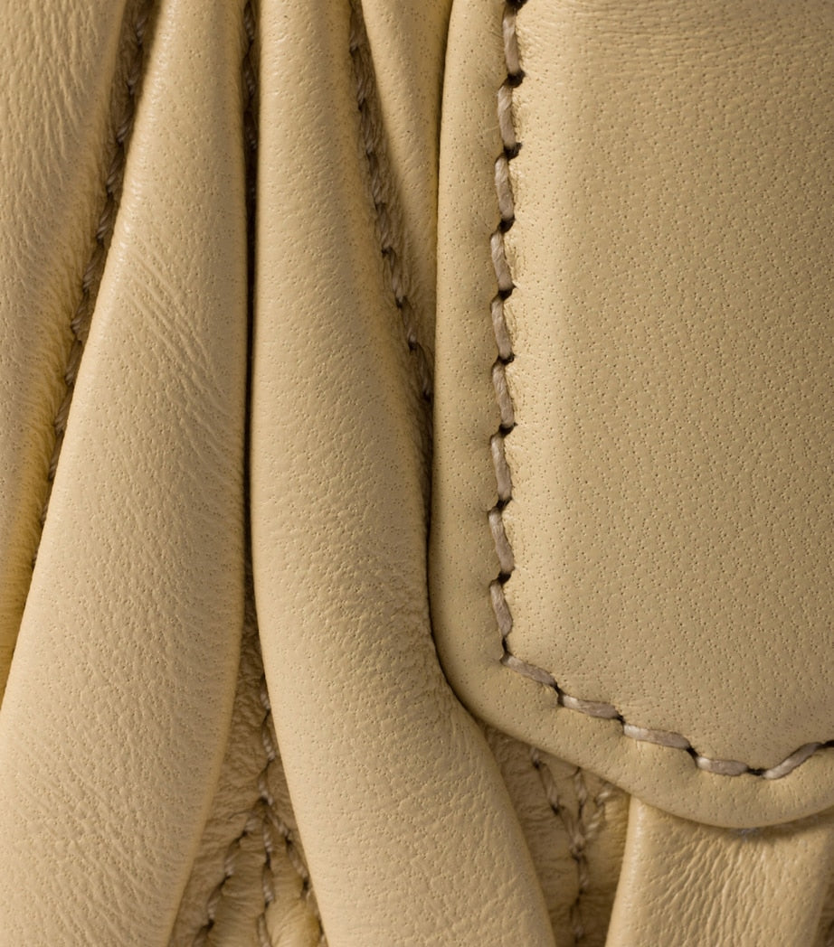 Miu Miu Arcadie matelassé leather top-handle bag, imported from the UK
