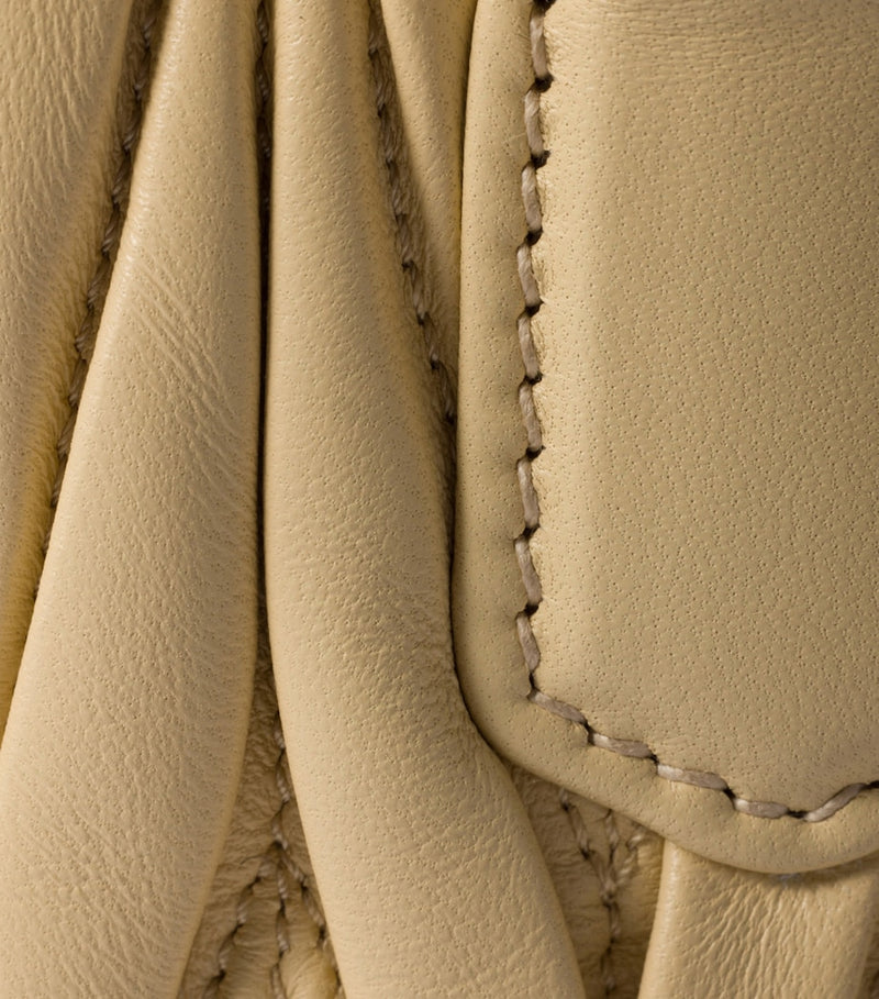 Miu Miu Arcadie matelassé leather top-handle bag, imported from the UK