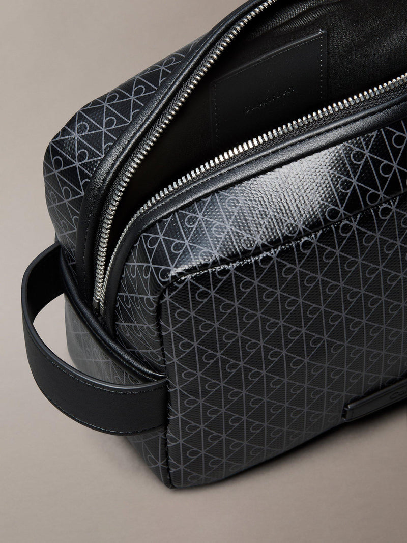 Calvin Klein monogram logo zip wash bag in black, UK version