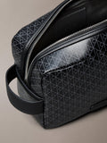 Calvin Klein monogram logo zip wash bag in black, UK version