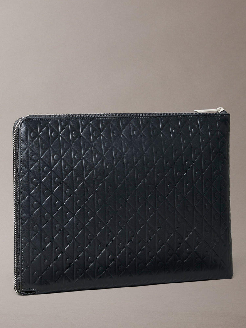 Calvin Klein leather embossed monogram pouch in black, imported from the UK