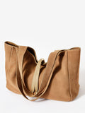 Mint Velvet slouchy suede shoulder bag in natural, imported from the UK