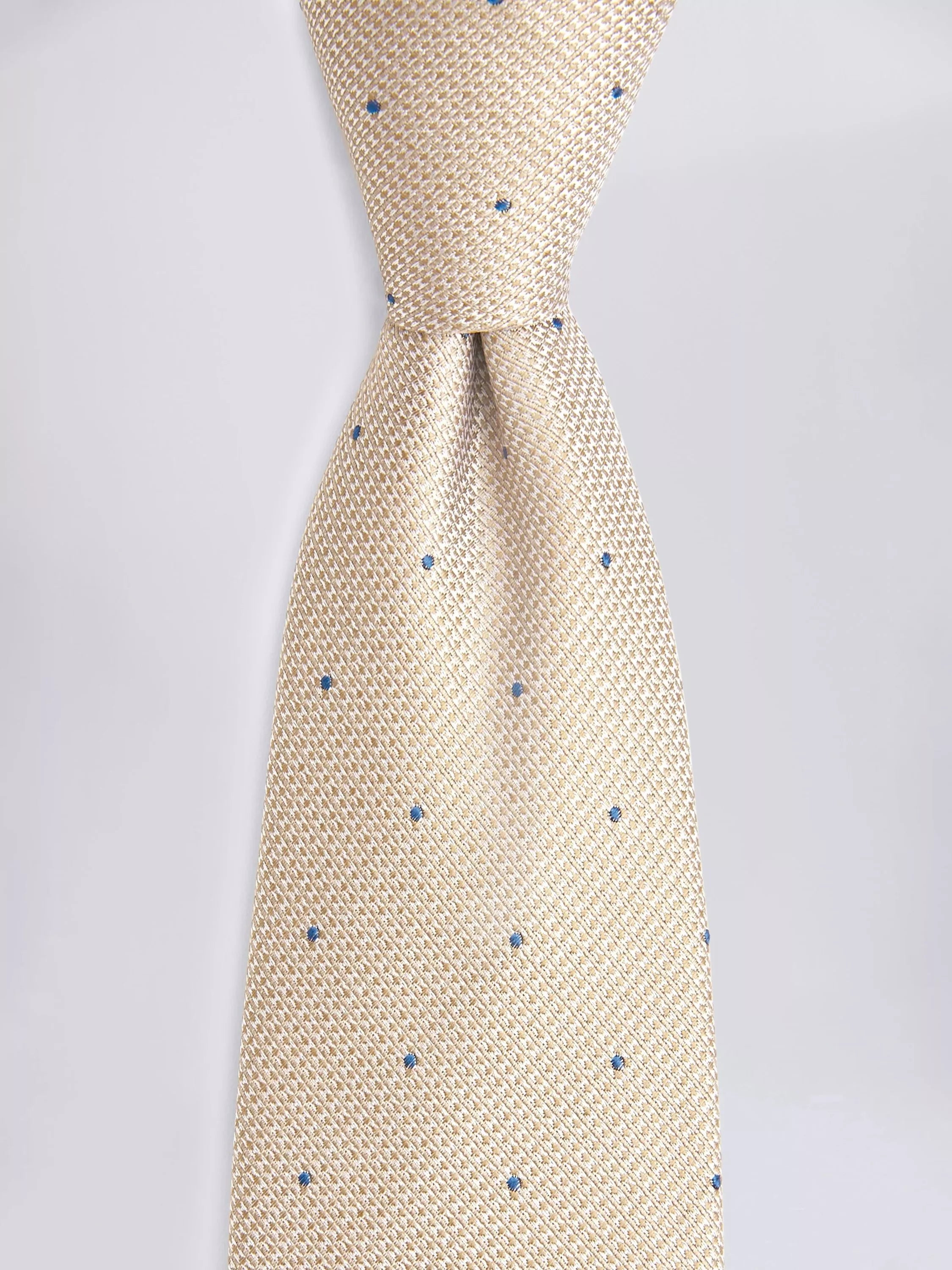 Moss champagne silk tie with blue spots, imported from the UK