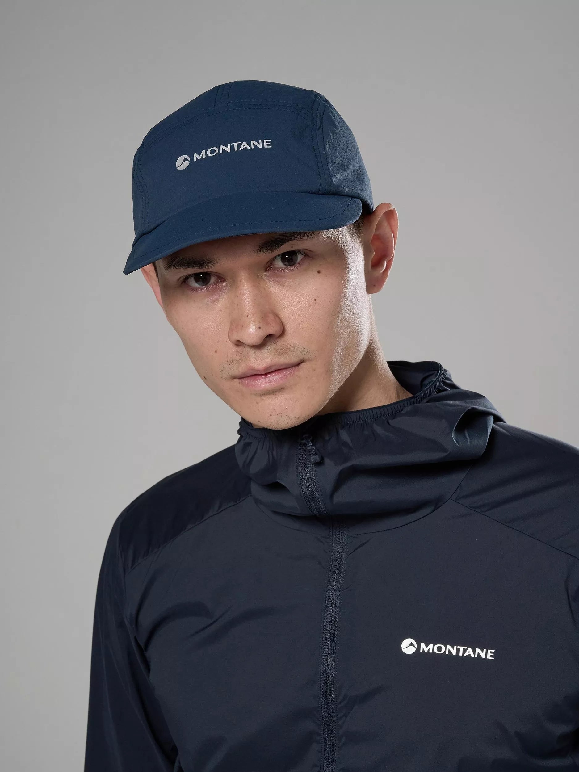 Montane Caelum Peak Cap in eclipse blue, imported from the UK