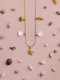 Orelia gold charm necklace with shell and starfish charms - British product