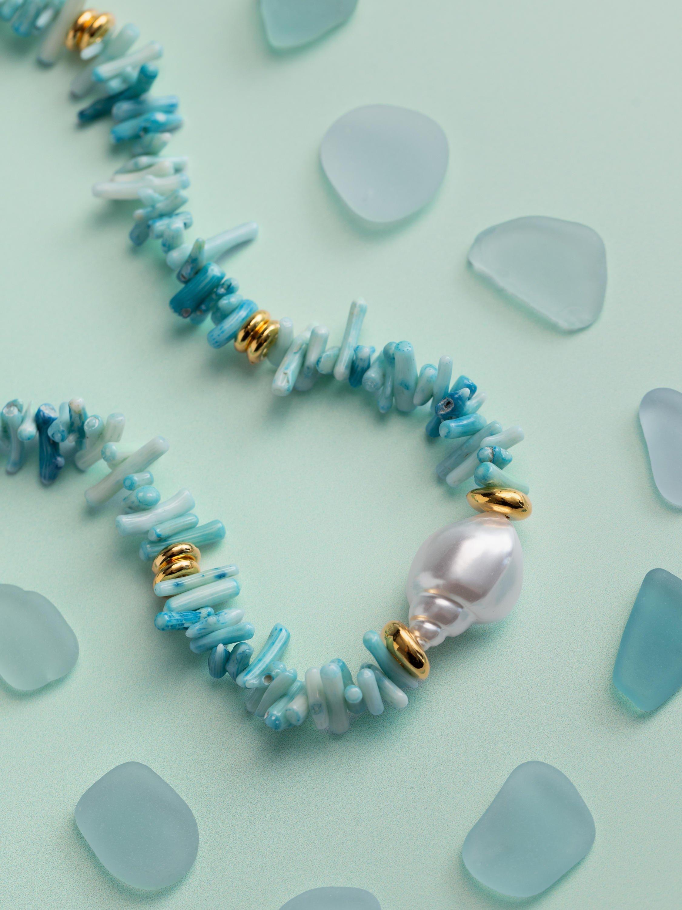 Orelia statement necklace with blue coral chips and pearls, gold plated, UK version