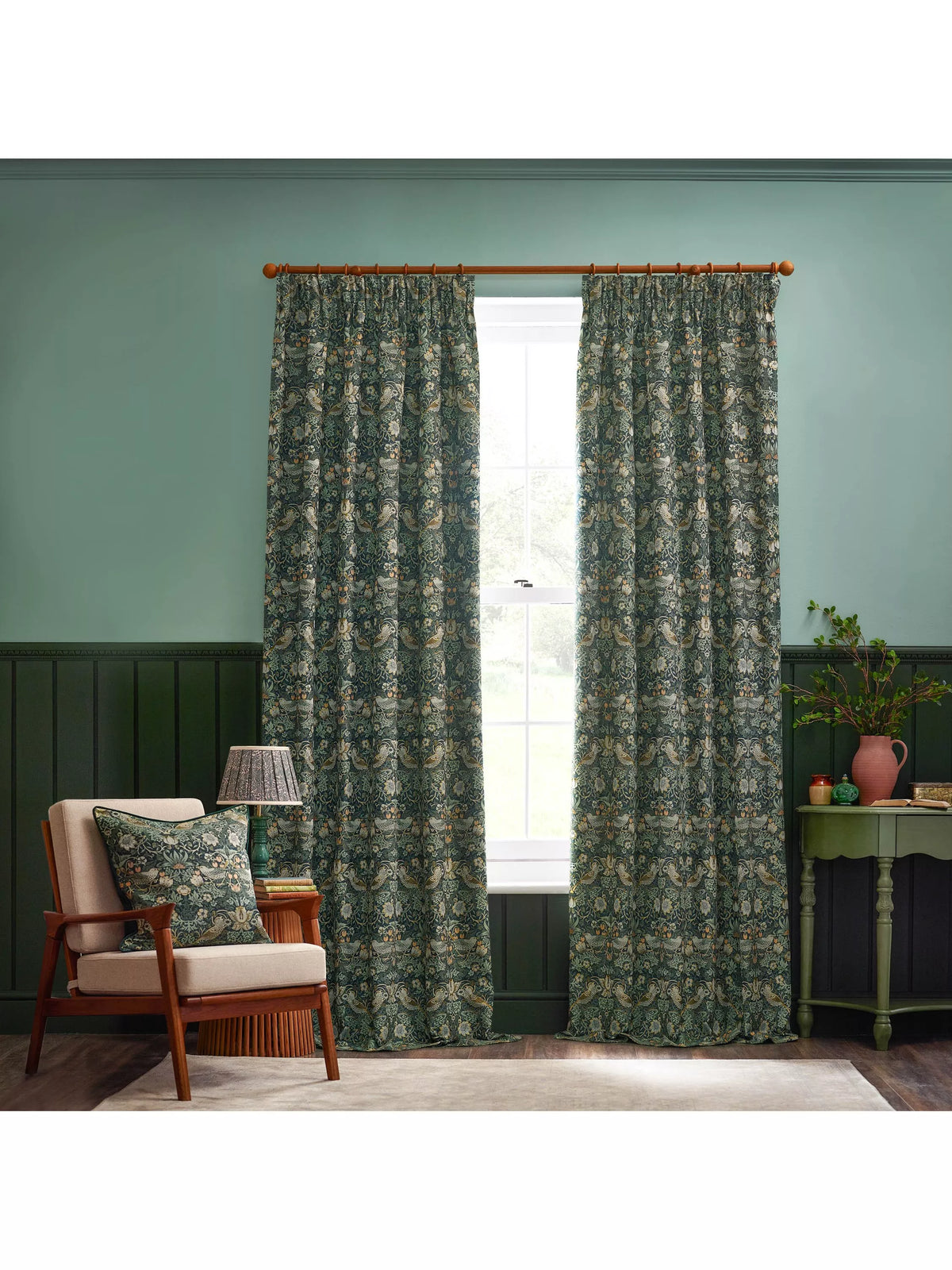Morris & Co Strawberry Thief curtains in forest green - British product