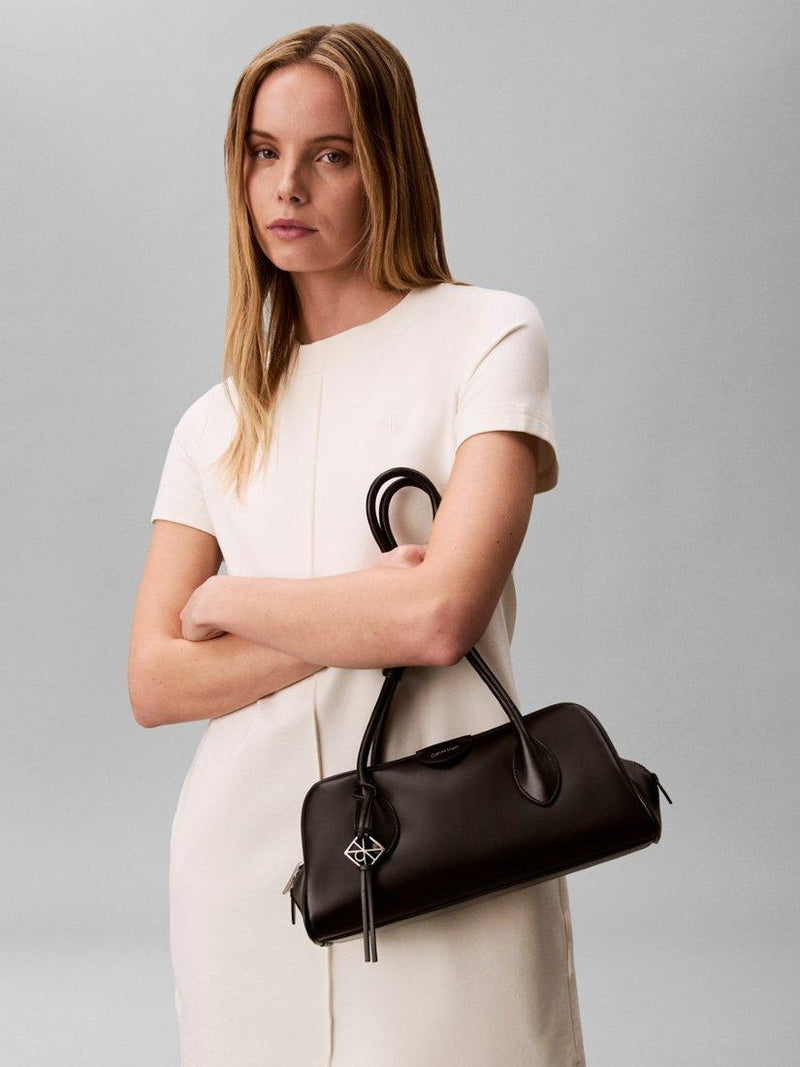 Calvin Klein Emblem shoulder bag in black, UK version