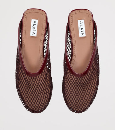 Mules plates Alaïa en résille
