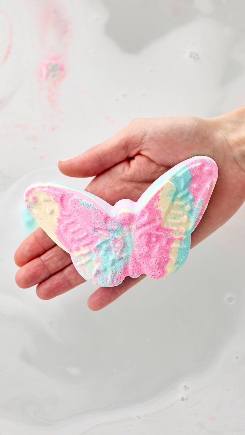 Lush butterfly bath bomb with pastel colours (British brand)