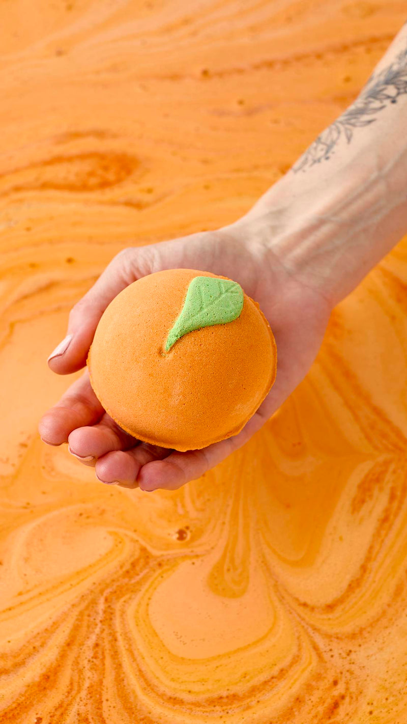 Lush whole fruit bath bomb in uplifting orange scent, UK version