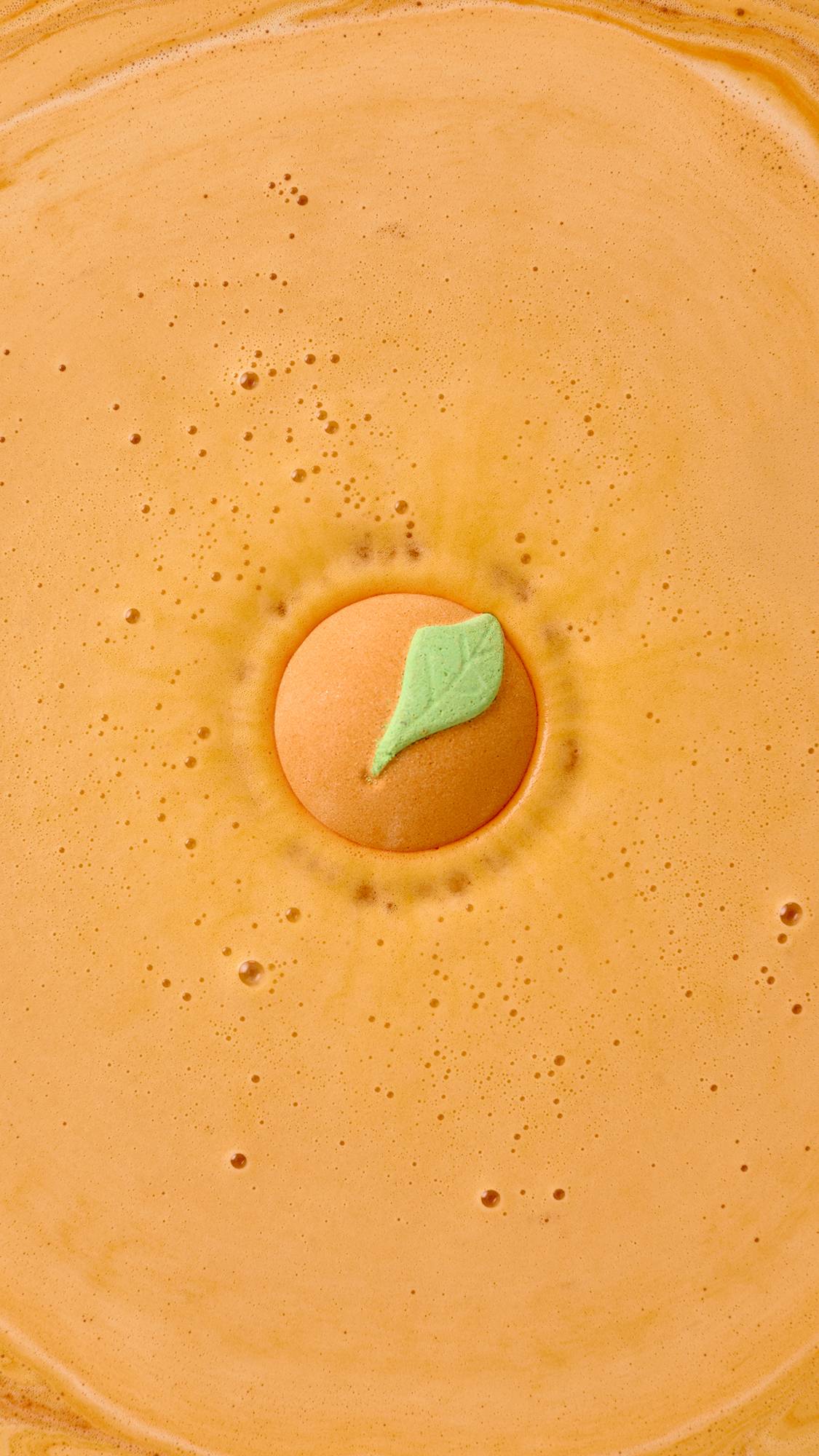 Lush whole fruit bath bomb in uplifting orange scent, UK version