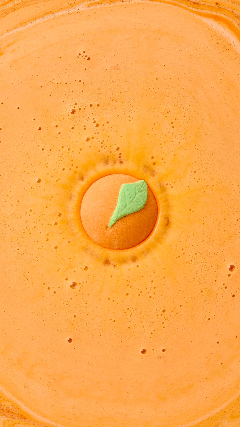 Lush whole fruit bath bomb in uplifting orange scent, UK version