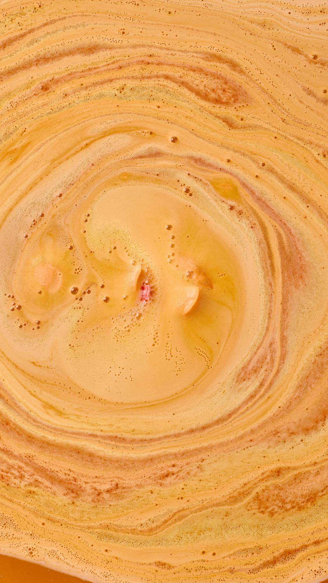 Lush whole fruit bath bomb in uplifting orange scent, UK version