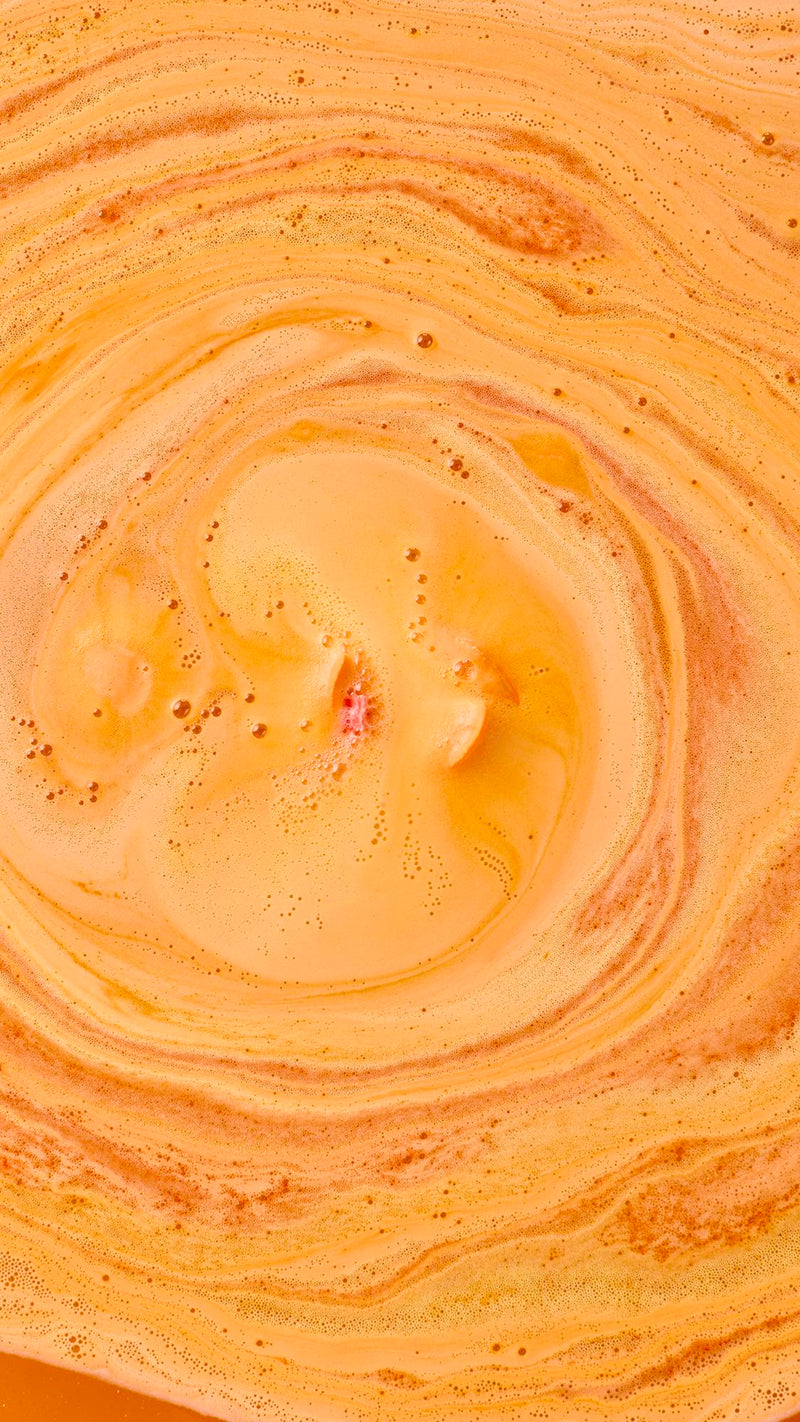 Lush whole fruit bath bomb in uplifting orange scent, UK version