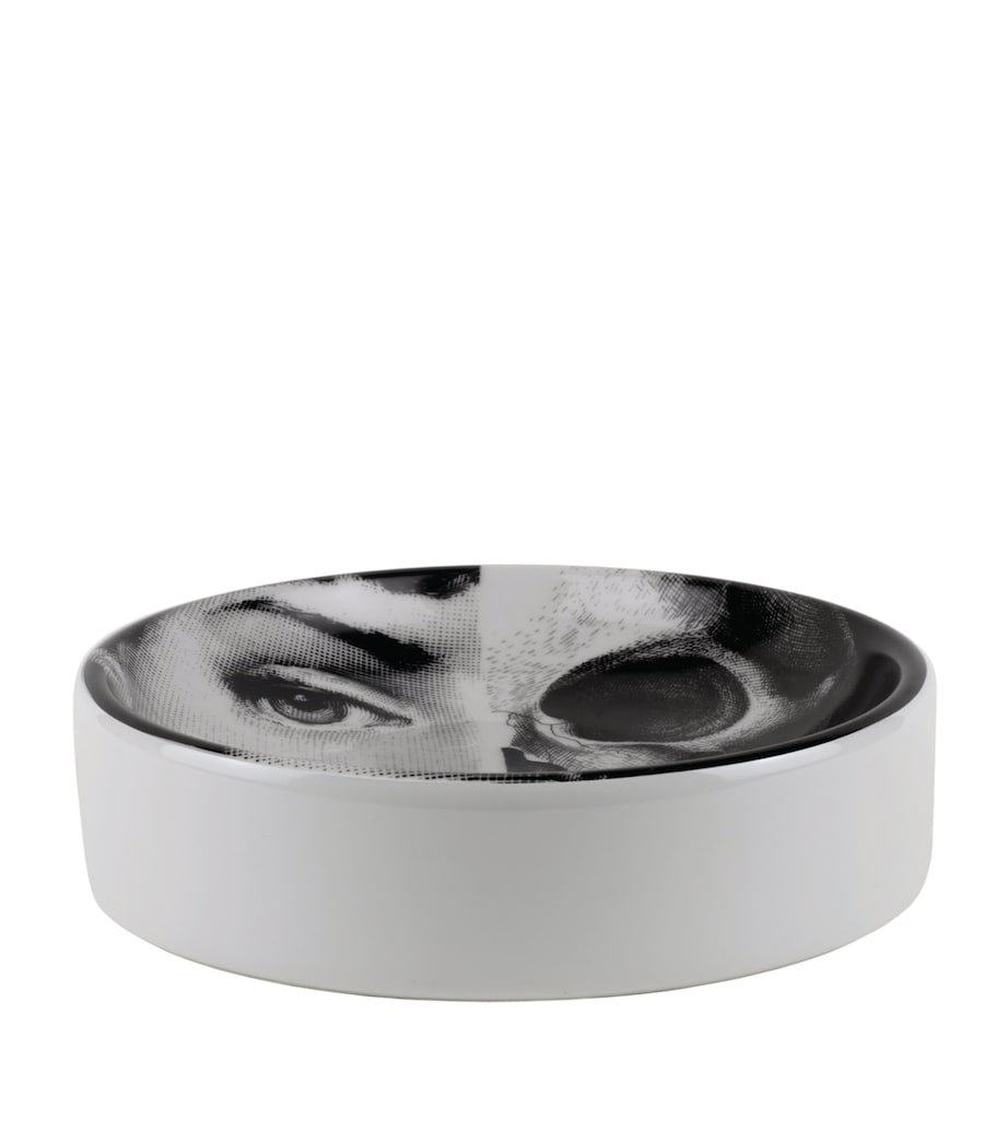 Fornasetti ashtray with face and skull design, number 288, approx. 3.5cm high and 13cm wide - British product