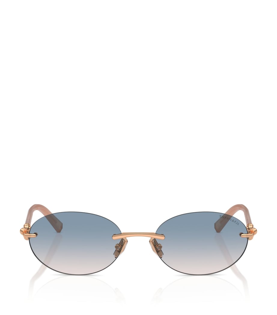 Tiffany & Co. rimless oval sunglasses with gold-tone temples, UK version