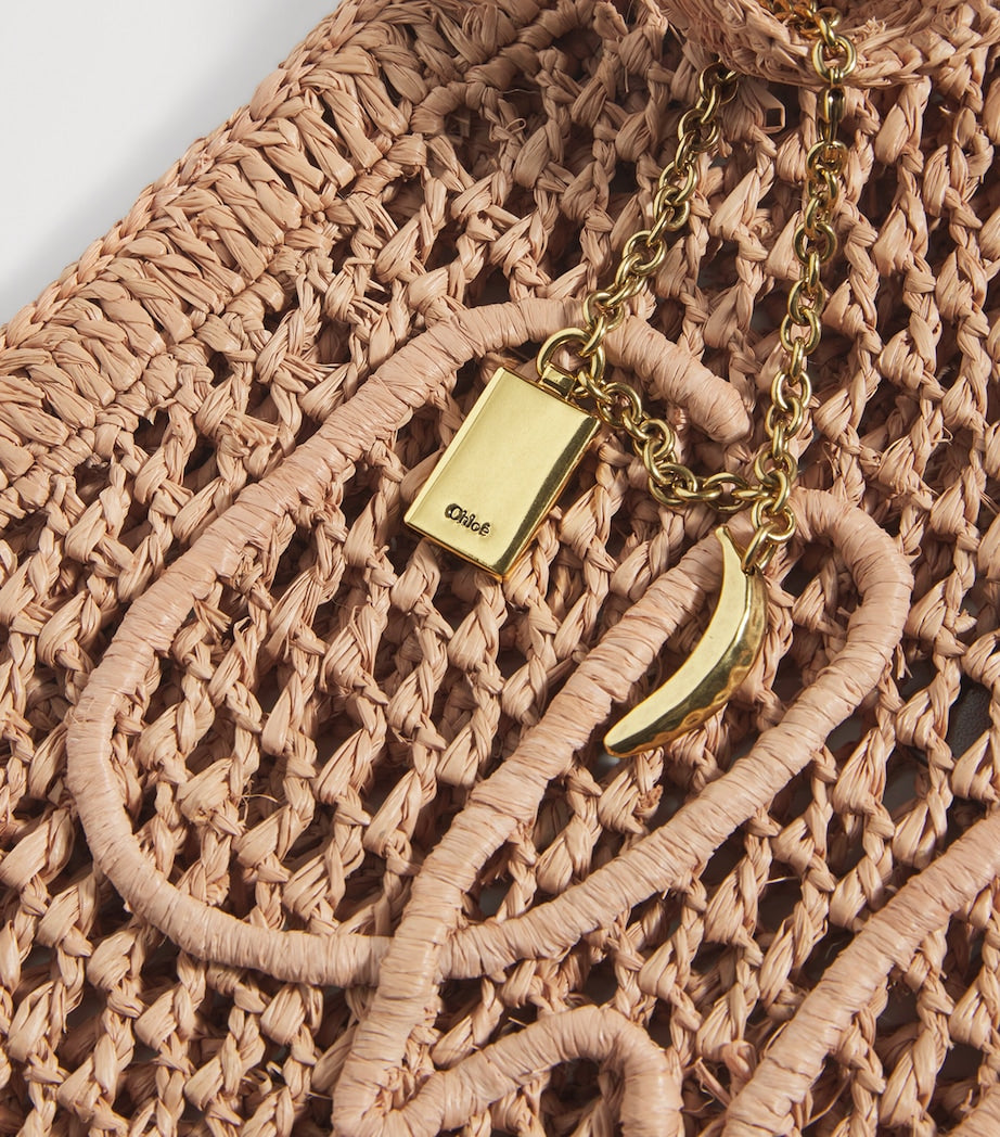 Chloé handwoven banana tote bag with gold charm, imported from the UK