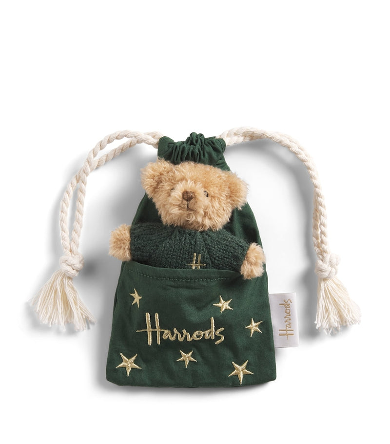 Harrods bear in pouch with green sweater (British brand)