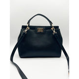SVNX black faux leather handbag with gold trim (British brand)
