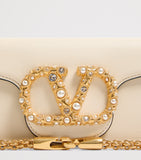Valentino Garavani Small Embellished Locò shoulder bag, imported from the UK