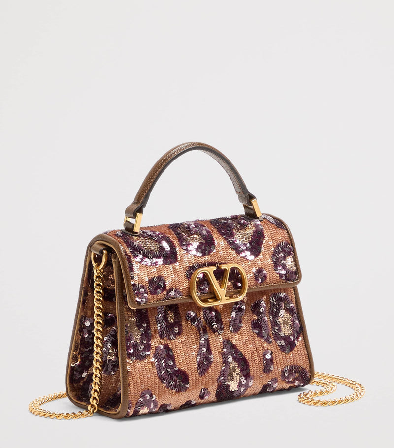 Valentino Garavani mini silk embellished VSLING top-handle bag, UK version